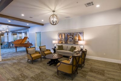 Cozy common area with seating and piano