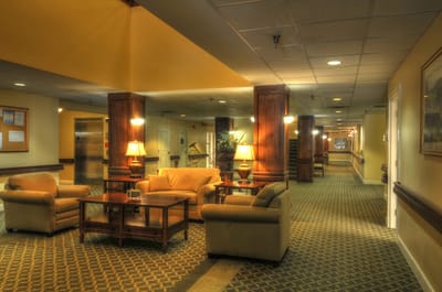 Cozy interior lounge area with seating and lamps