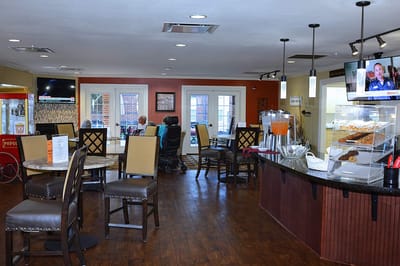 Residents enjoying snacks in the dining area