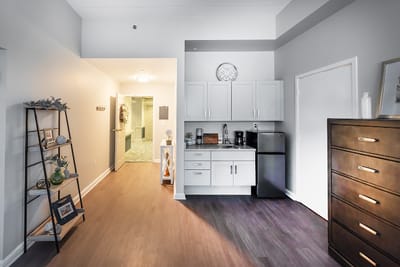 Interior view of a resident room with kitchenette