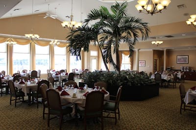 Bright dining room with tables set for meals