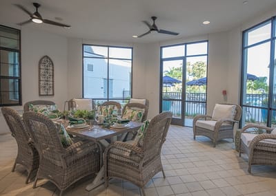 Bright, inviting sunroom with dining setup