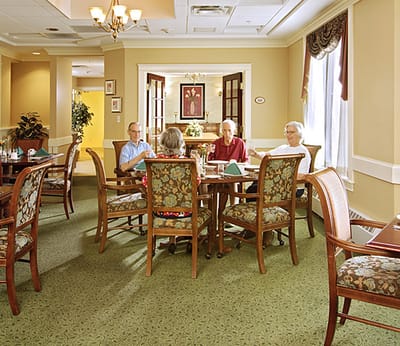 Residents enjoying a meal in the dining room