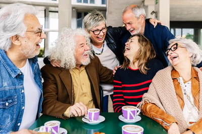 Group of residents enjoying coffee and laughter together