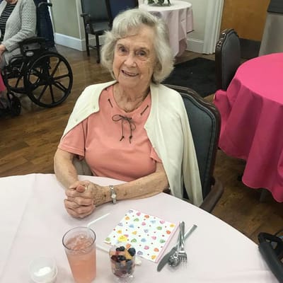 Resident enjoying a meal in the dining room
