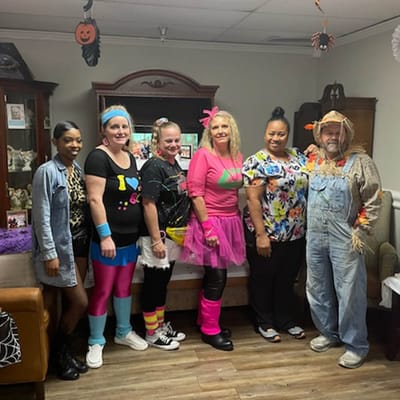 Staff and residents in fun costumes during an event