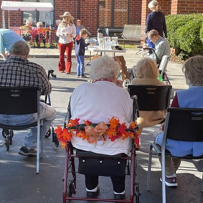 Residents and children participating in an outdoor activity