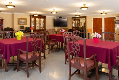 Dining room with tables and floral centerpieces