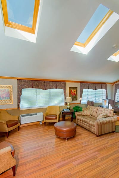 Interior of a bright common area with seating