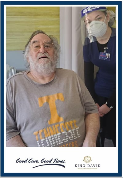Resident with staff member in a care facility