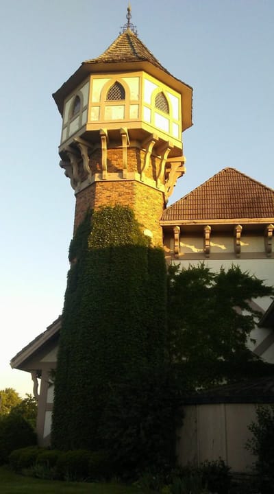 Exterior view of the facility with a turret under sunlight
