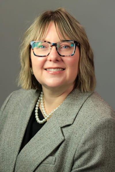 Professional portrait of a woman in a blazer