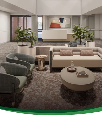Bright common area with modern furnishings and plants