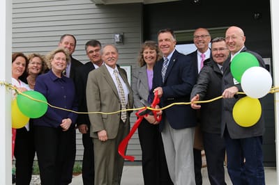 Facility opening ceremony with staff and community members