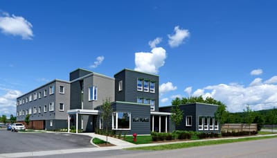 Exterior view of Cathedral Square facility with blue sky