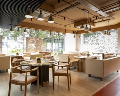 Modern dining room with natural light and seating