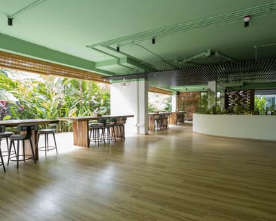 Bright and spacious common area with tropical plants