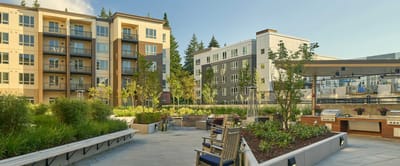 Outdoor seating area among modern buildings