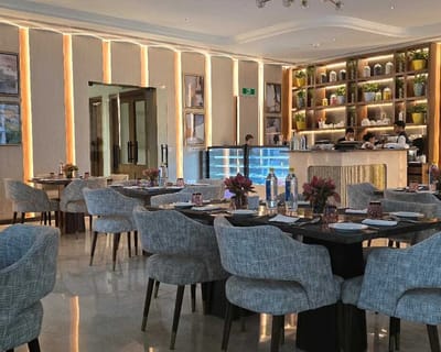 Modern dining room with staff behind the counter