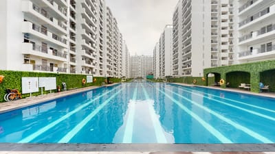 Outdoor swimming pool surrounded by residential buildings