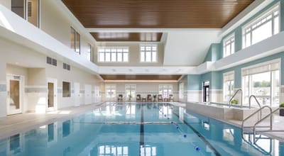 Indoor swimming pool area with natural lighting