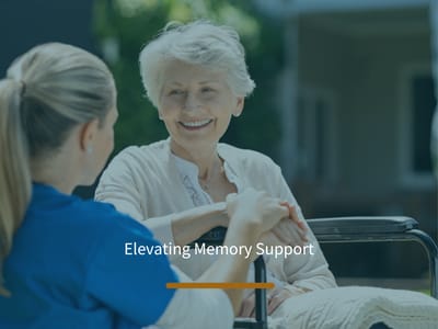 A caregiver and resident in a garden setting