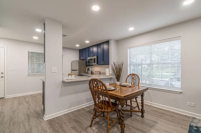 Modern dining area with wooden table and chairs