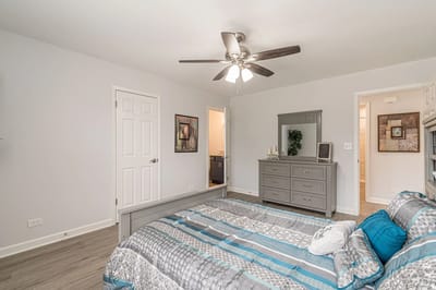 Private bedroom with a bed and dresser
