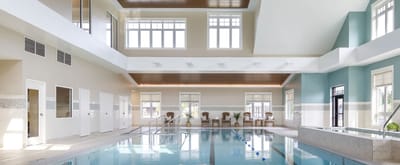 Indoor swimming pool area with natural light