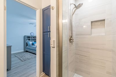 A view of a modern bathroom and bedroom at the facility