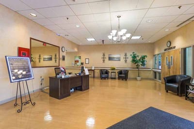 Interior lobby area with seating and reception desk