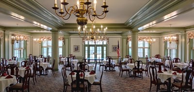 Elegant dining room with tables set for a meal