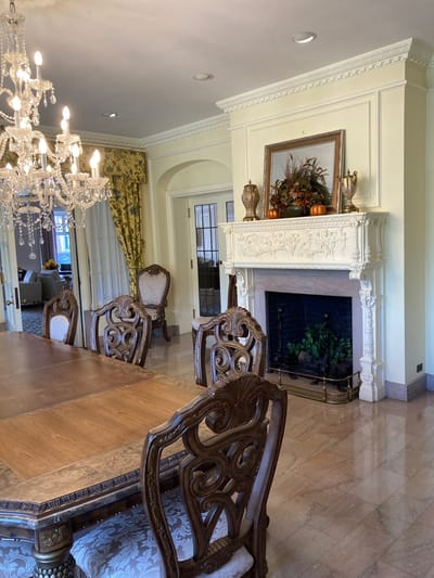Elegant dining room with chandelier and wooden table