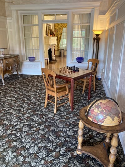 Interior activity area with chessboard and globe