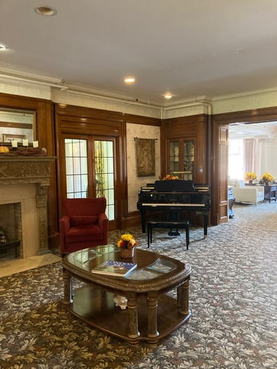 Interior of a common area with piano and seating