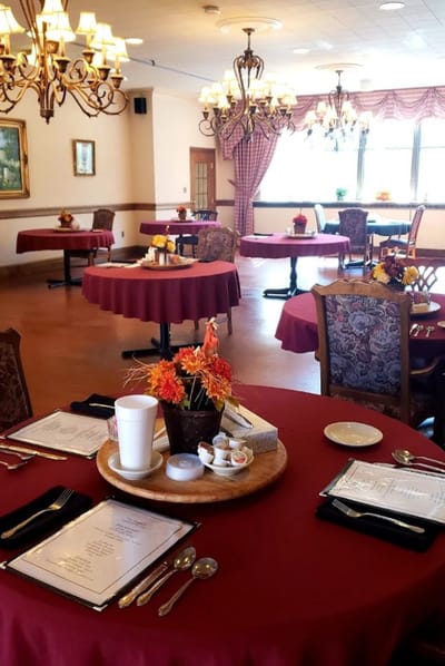 Elegant dining room setup with floral arrangements