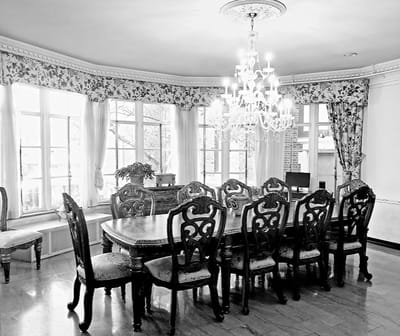 Elegant dining room with antique furniture and chandelier