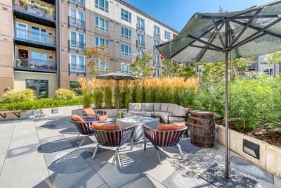Outdoor lounge area with seating and landscaping