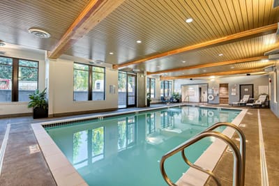 Indoor swimming pool area with natural light