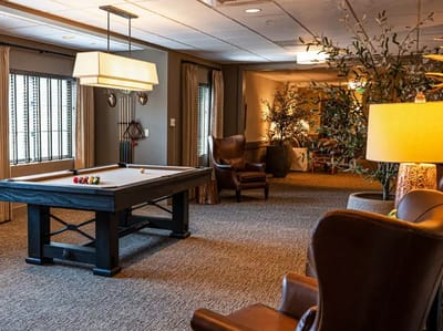 Common area with a pool table and seating