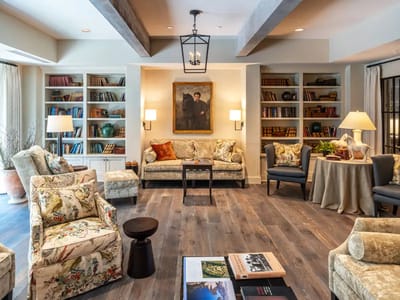 Cozy common area with seating and bookshelves