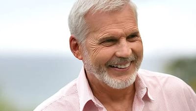 Senior man smiling outdoors