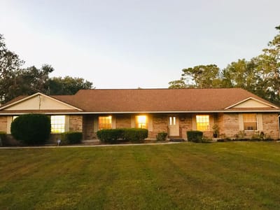 Exterior view of a senior care facility at dusk