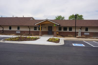 Exterior view of the facility entrance and garden