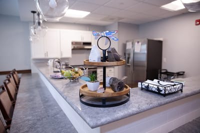 Common area kitchen with decorative items on a counter