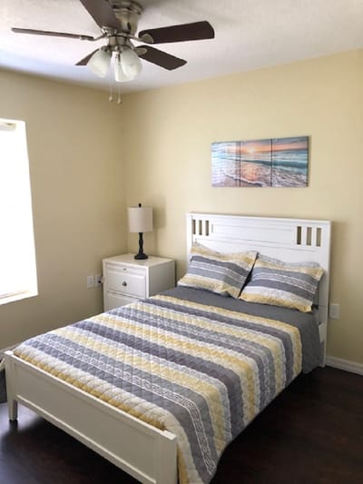 Cozy private resident room with a bed and lamp