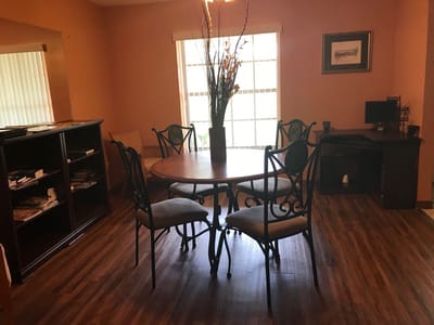 Common area with a round table and seating