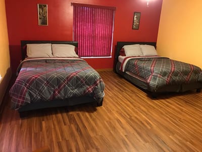 Private resident room with two beds and colorful walls