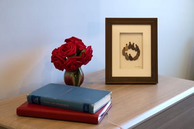 Decorative table arrangement with flowers and books