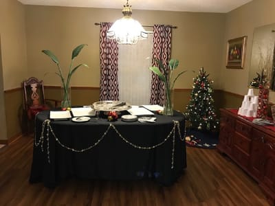 Dining area decorated for a celebration with a Christmas tree